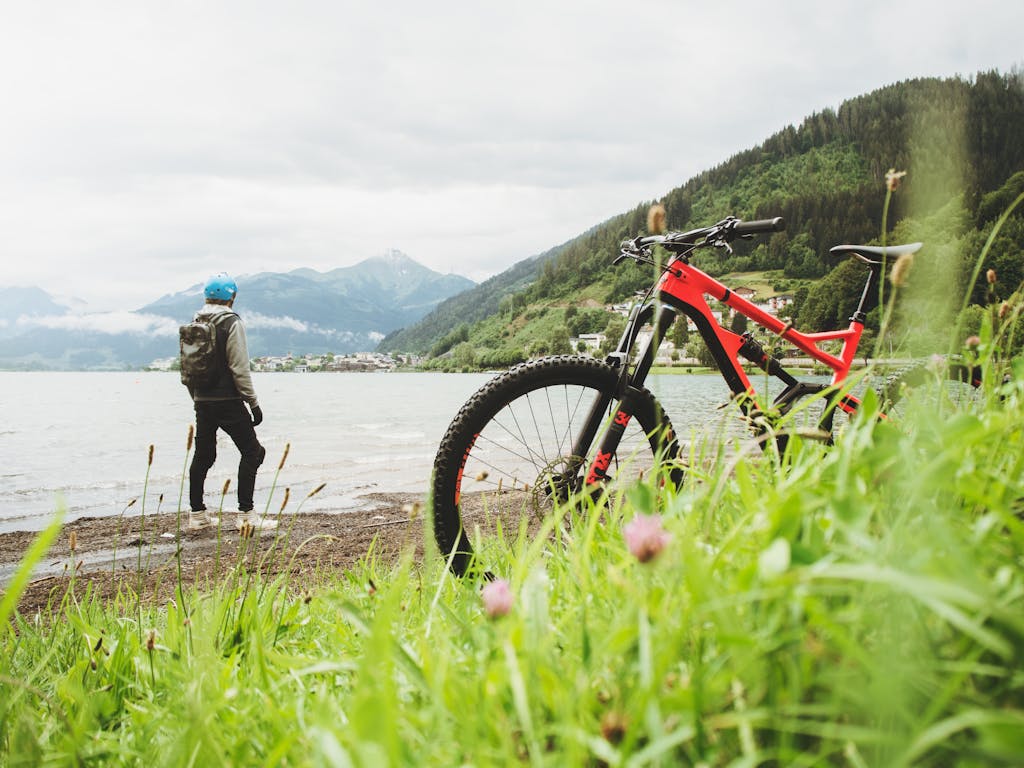 Serlig Cyclist overlooking Zell am See in Salzburg, Austria. Perfect for adventure and travel themes.