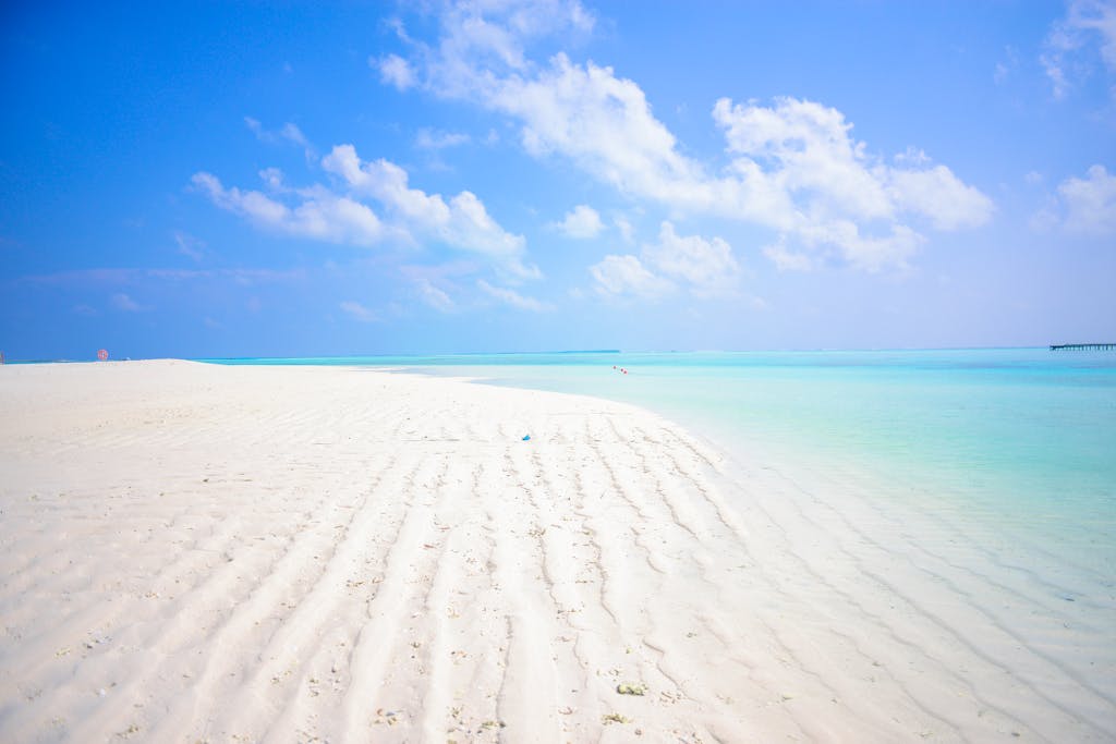 Sotwe Idyllic tropical beach with white sands and turquoise sea in Maldives.