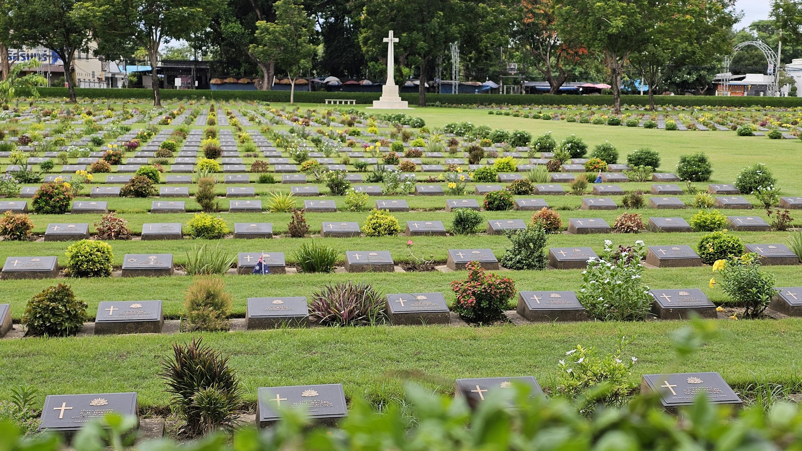 The World of Dojen Moe A tranquil view of war graves in Kanchanaburi's beautifully landscaped cemetery.