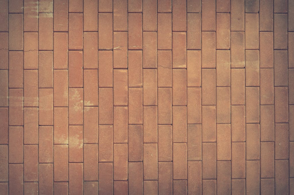 Sotwe A vintage red brick wall texture serves as a classic background with rich earthy tones.