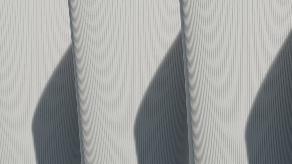 MMSBRE Abstract architectural image showcasing minimalist lines and strong shadows.