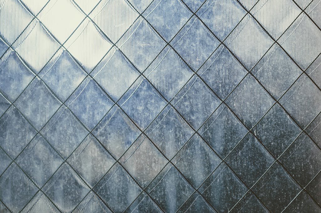 Edivawer Close-up of a textured metal surface with geometric patterns, captured in Busan, South Korea.