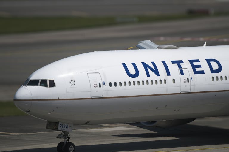 United Flight UA109 Diversion Close-up of a United Airlines airplane on taxiway, emphasizing the aircraft's details.
