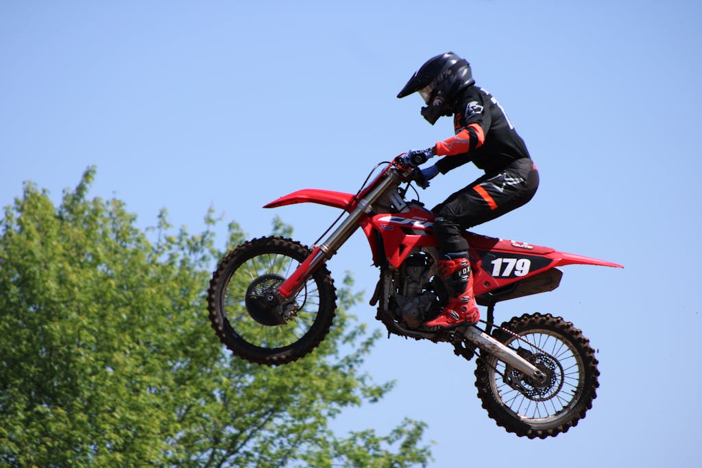 Ohio Champion Trees Lewis Center Ohio Exciting motocross jump by dirt bike rider in Carroll, Ohio under clear skies.