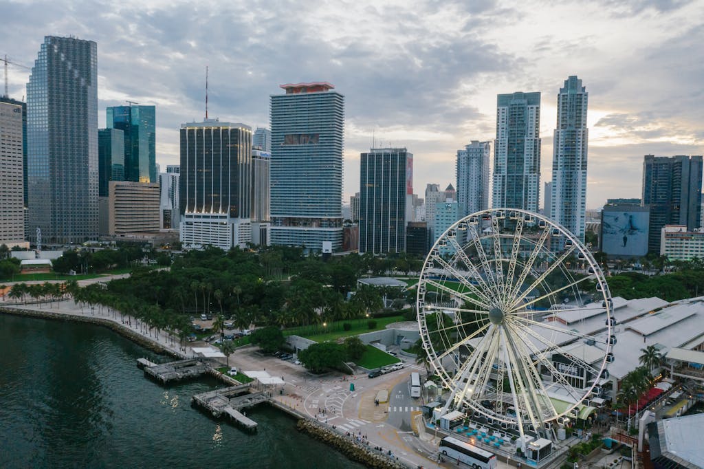 Inter Miami  Explore the vibrant Miami skyline with a glimpse of the iconic Ferris wheel, perfect for travel enthusiasts.