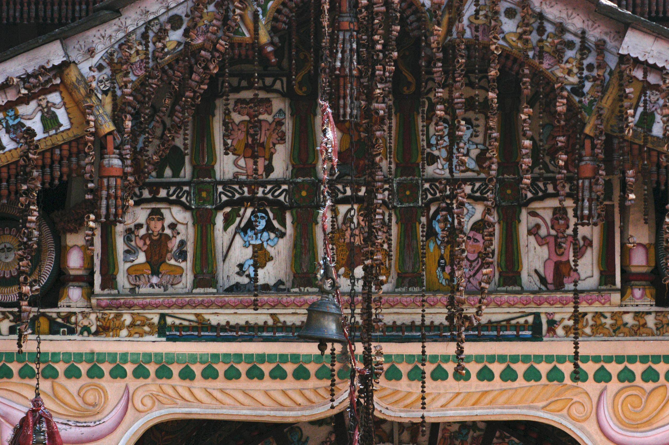 Messeregge Intricately decorated Hindu temple facade showcasing vibrant sculptures and spiritual motifs in Hanol, India.