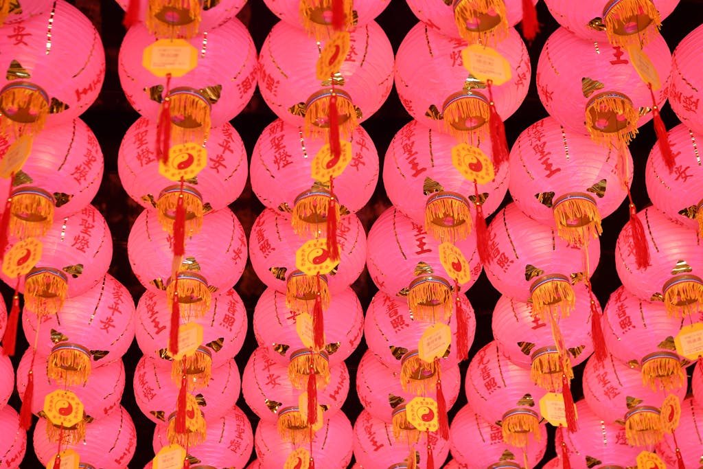 123safe67 Rows of pink lanterns with red tassels creating a vibrant and festive atmosphere.