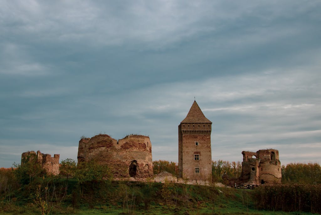 bac stock A medieval fortress in Bač, Serbia, showcasing ancient architectural ruins under a dramatic sky.